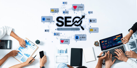 A dynamic workspace showcasing a digital marketing team analyzing SEO strategies with charts and laptops, illustrating modern collaboration in business development. Trope