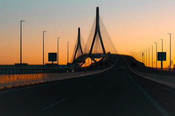 Bridge at sunset. Сable-stayed bridge, unusual bridge, silhouette. Spain, Cadiz