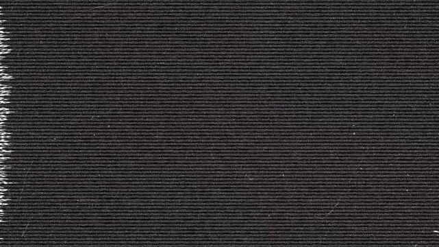 Close-up of textured dark paper with horizontal lines