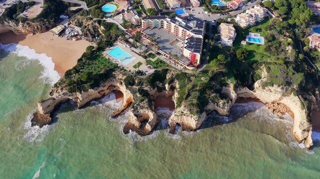 The Golden Coast: Aerial Cinematic 4K View of Luxury Villas, Resorts, and Real Estate at Alporchinhos Overlooking the Turquoise Waters of Praia de Albandeira, Algarve, Portugal