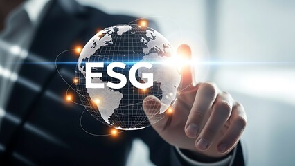A business professional interacts with a glowing orb displaying the letters esg representing environmental social governance concepts