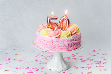 Celebrating a milestone with a beautiful pink and yellow 50th birthday cake