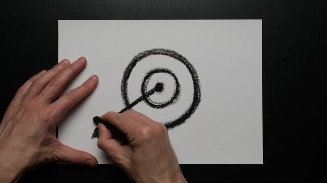 Focus on target as hand drawn arrow hitting the center symbolizing goal achievement precision strategy and clear direction in business learning and personal growth