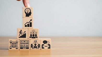 Building business success with strategy and teamwork illustrated by wooden blocks with icons
