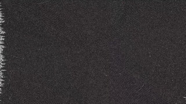 Close up of circular pattern on dark woven mat at Daytime