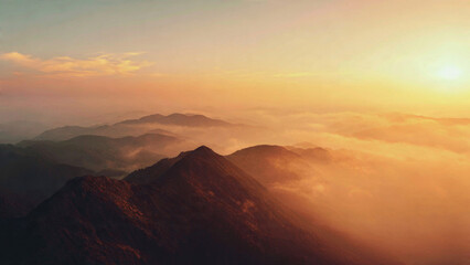 Fototapeta premium Mountains at Sunset with Fog