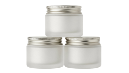 Stack of three frosted glass cosmetic jars with silver lids isolated PNG, beauty product containers for cream or lotion on transparent background