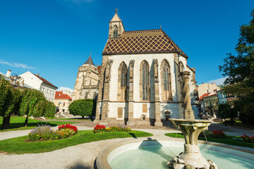 Beautiful city park with fountain in front of medieval Saint Michael chapel and Saint Elizabeth cathedral on Hlavna (Main) pedestrian street in downtown Kosice, Slovakia