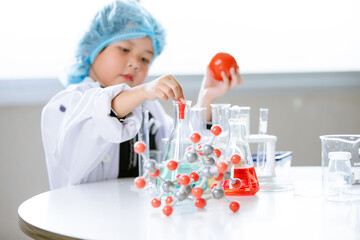 Asian little cute girl students. Girl doing science experiment science classroom. Education research and development concept learning kids.