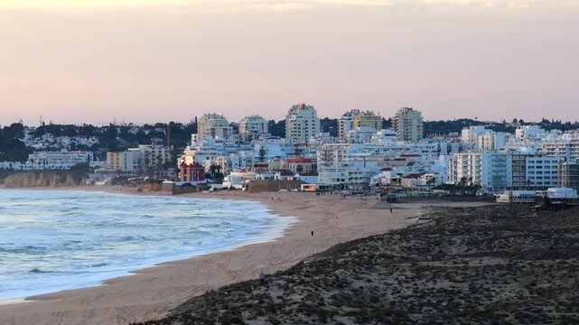 Algarve Luxury Real Estate: Panoramic 4K Aerial View of Premium Villas and Resorts in Arma&ccedil;&atilde;o de P&ecirc;ra Overlooking the Turquoise Coastline of Praia de Albandeira, Portugal