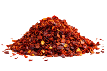 Pile of red chili flakes isolated on transparent background. Pile of vibrant red chili flakes scattered for cooking isolated on white background.