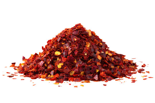 Pile of dried chili flakes isolated on transparent background. Pile of red pepper flakes isolated on white background.