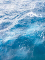 Aerial view of blue water waves from a cruise boat in the Atlantic Ocean © J