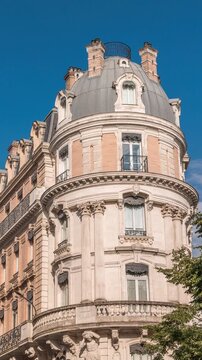 Rue de Metz timelapse in Toulouse, Occitanie, France, with historic facades, shops, cafes and a blue cloudy sky. Vibrant urban scene in the heart of the city