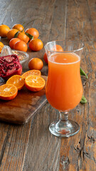 a glass of citrus fruit juice on table