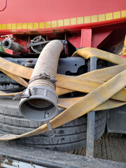 Water supply hose of red tanker truck