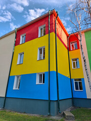 Many-coloured facade of school building