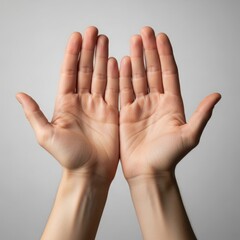 Two Open Hands Facing Forward Side by Side Representing Honesty, Openness or Surrender