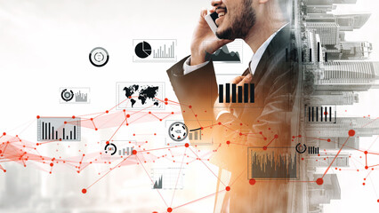 A professional businessman engages in a phone conversation, surrounded by data visualizations and...