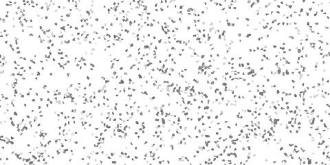 Abstract grayscale mosaic pattern with scattered irregular shapes on a white background for graphic design and texture applications