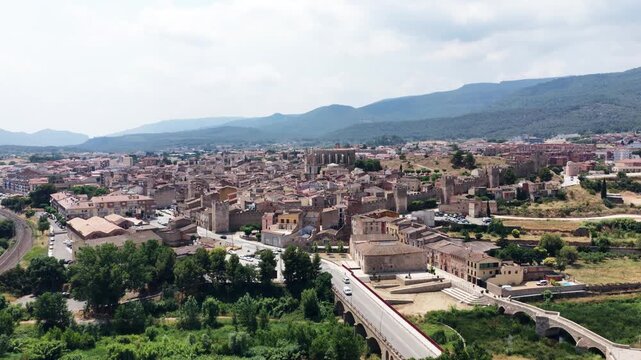 Drone view showing the medieval walled city of montblanc in catalonia, spain. Beautiful historical architecture surrounded by mountains