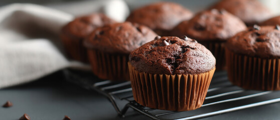 Chocolate beetroot muffins on a cooling rack with a cozy kitchen backdrop
