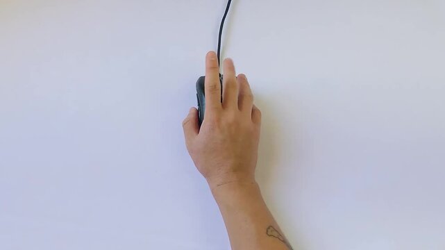 Finger tapping on the computer mouse in white background