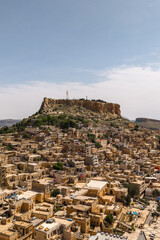 Aerial view of Mardin city and its castle. Vertical photo