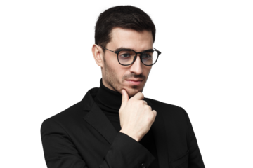 Thoughtful businessman in black suit and turtleneck with glasses touching chin in pensive pose