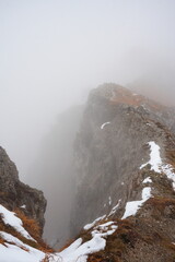 snow-capped mountain ridge among the clouds, Italy