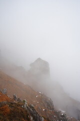 rock in the mountains among the clouds, Italy