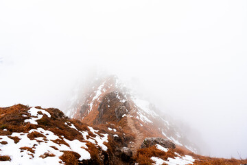 snow-capped mountain ridge among the clouds, Italy