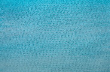 A close-up of a fragment of blue sky painted with watercolors.