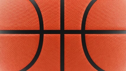 Close-up detail of an orange basketball surface with black seams