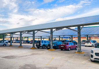 Covered car park with photovoltaic shade structures, sustainable design and modern infrastructure. Sustainable infrastructure with solar energy use