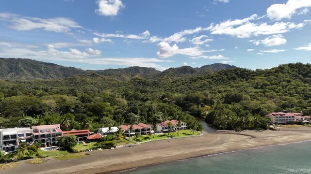 Aerial reverse flyaway beach condos in Costa Rica
