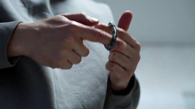 A man holds a Muslim prayer bead.
Islam and faith in Allah.
Prayer to Allah.
Prayer beads.
A man prays to Allah in Islamic culture.
Culture, faith, bracelet, talisman