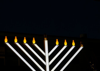 Hanukkah Menorah against the night sky on the Hanukkah celebration in the Cherry Creek District in Denver, Colorado
