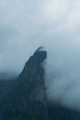 Mysterious Mountain Peak Surrounded by Clouds and Misty Atmosphere at Loei Thailand