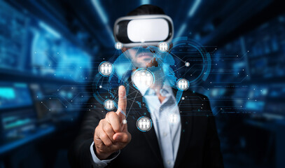 A businessman uses virtual reality technology to engage with a global network, emphasizing digital connections and innovative communication in today business landscape. XDMCP