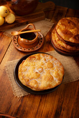 Bu&ntilde;uelos de rodilla. Traditional food at Christmas and winter holidays in Mexico, these are fried dough flour sprinkled with sugar or covered in a syrup made with piloncillo, cinnamon, and guava.