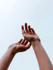 Two hands reach upward expressing aspiration and freedom against serene blue sky. Generative AI.