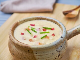 Close up of creamy cheesy potato soup.