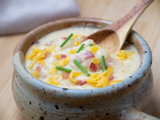 Spoon scooping out some soup.