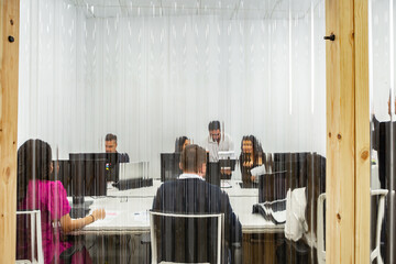 Collaborative work session in a modern coworking space with multiple participants