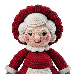 Crochet Mrs Claus doll, handmade amigurumi Christmas character isolated on white background
