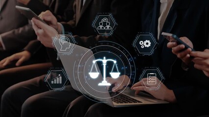 Professionals engage with digital devices while discussing aspects of the justice system, featuring a scales of justice symbol, highlighting modern technology in law. Raster