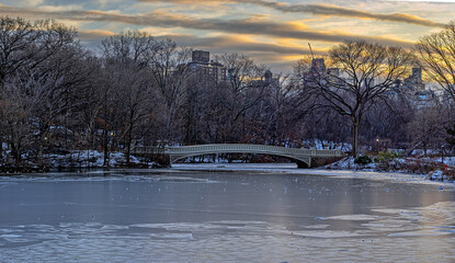 Bow bridge in winter after light snow