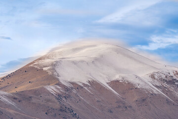 Freshly fallen snow on a mountain peak