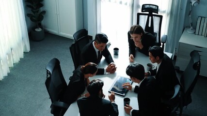 Top view of diverse business team discuss about marketing idea while businessman analyze financial graph from tablet at meeting room. Group of smart team brainstorm idea at conference. Directorate. - Powered by Adobe